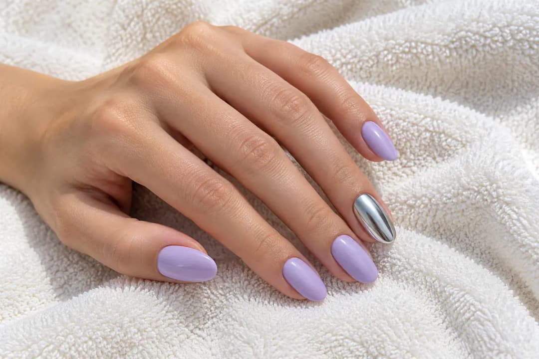 Medium almond lavender nail style idea with one silver chrome accent nail